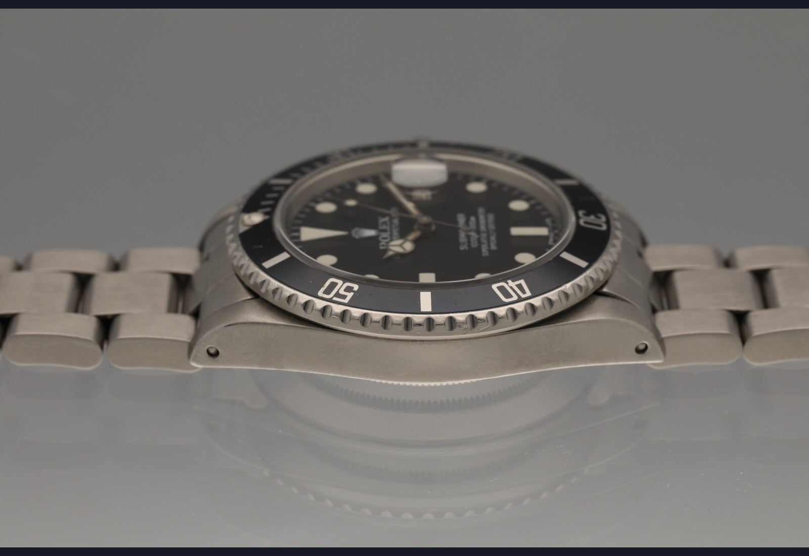 Snow White Transitional 16800 Submariner with a Tropical Blue insert