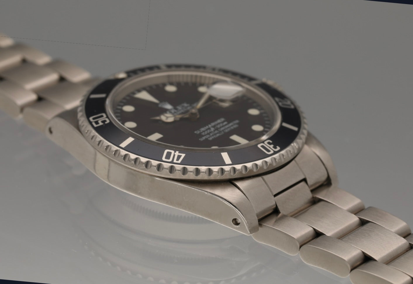 Snow White Transitional 16800 Submariner with a Tropical Blue insert