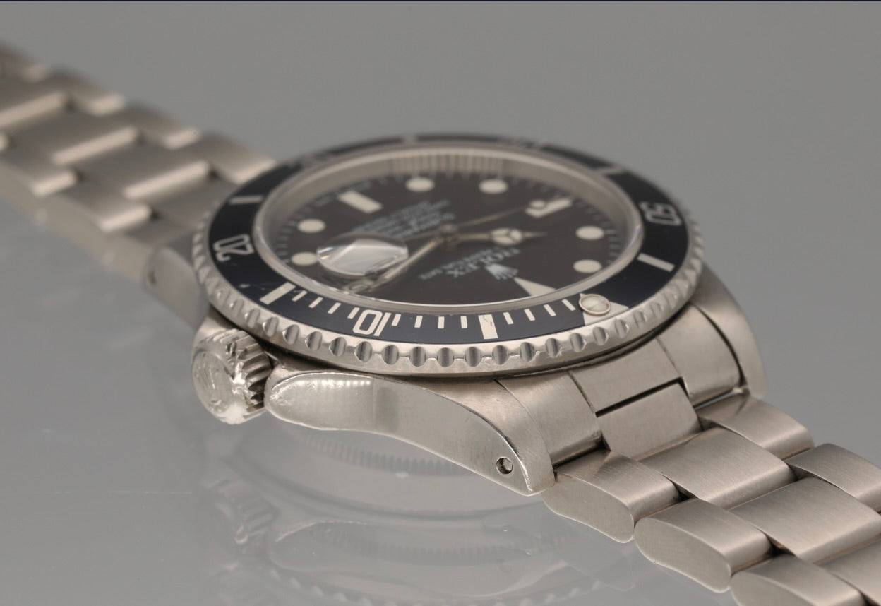 Snow White Transitional 16800 Submariner with a Tropical Blue insert