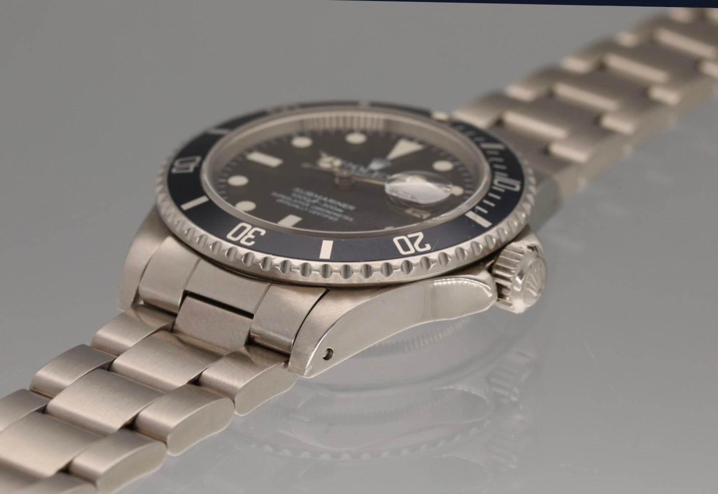 Snow White Transitional 16800 Submariner with a Tropical Blue insert