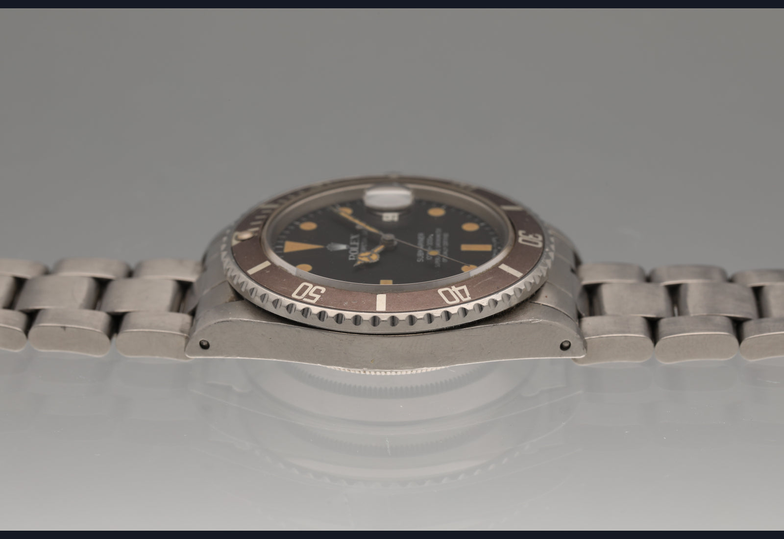 1982 Rolex Transitional Submariner super pumpkin patina vs matte brown bezel